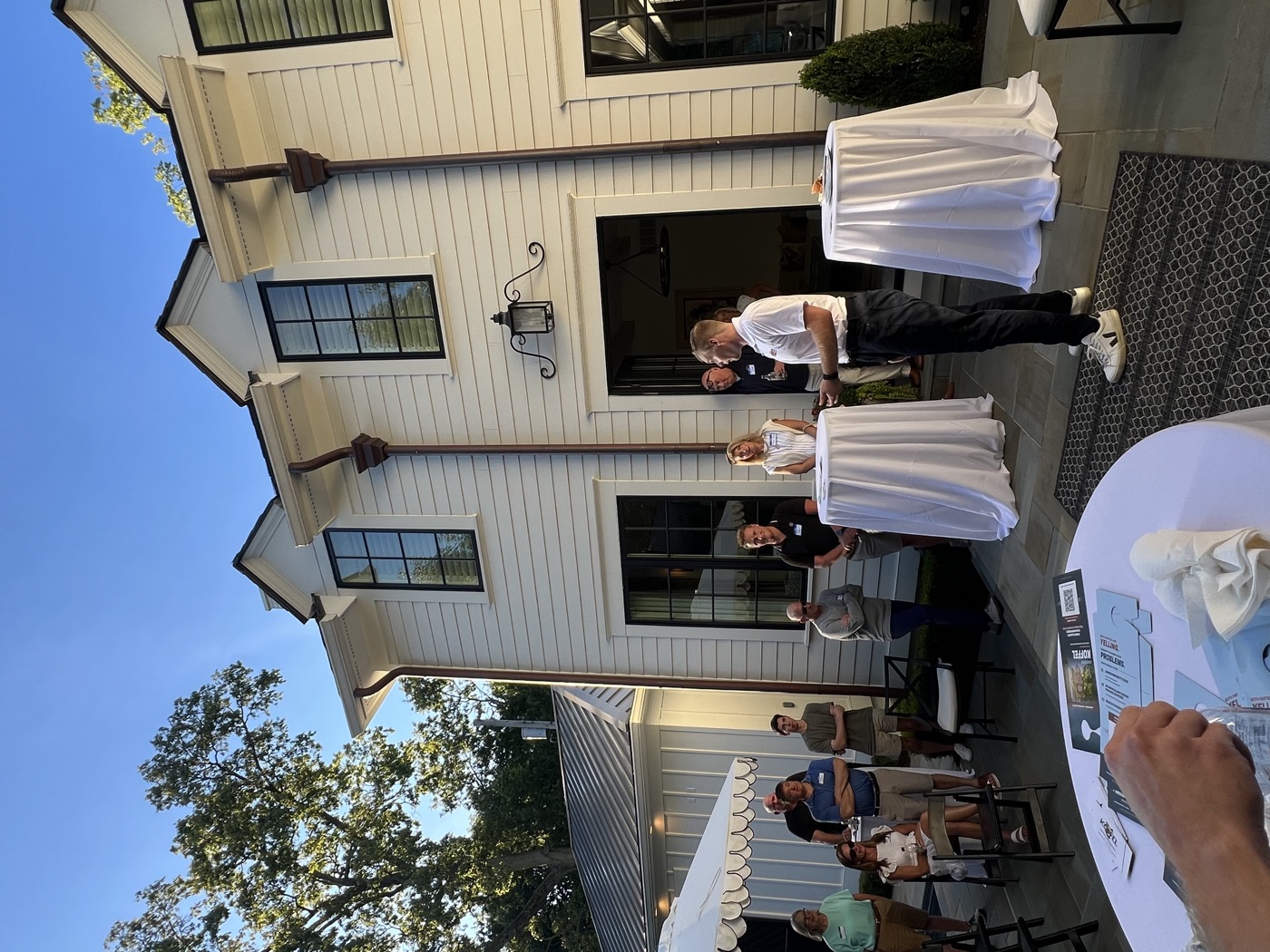 Cameron Koffel speaking to neighbors at a meet-and-greet in District 7