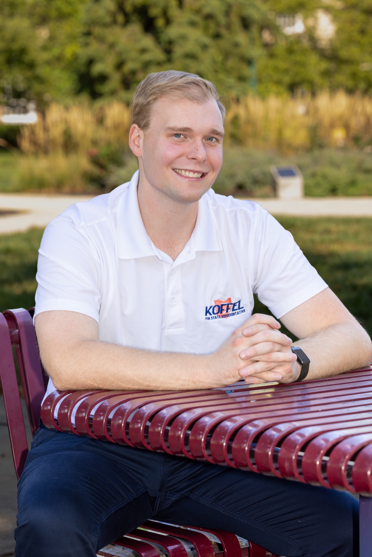 Cameron Koffel at a bench in a District 7 park